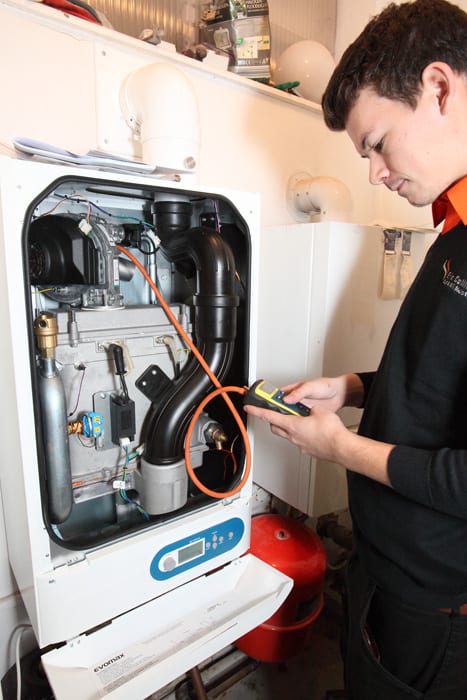 boiler service being carried out by an engineer