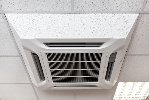 White air conditioning unit place inside of a office building in Cardiff, South Wales